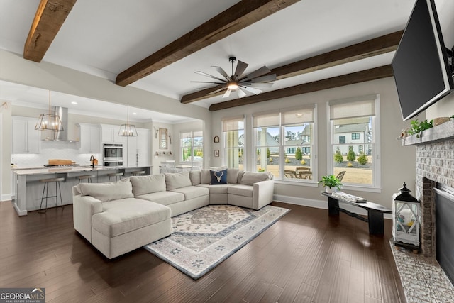 2903 Eva Clb, Acworth, GA 30101 - living room with a fireplace, beam ceiling, a ceiling fan, dark wood-style flooring, and recessed lighting