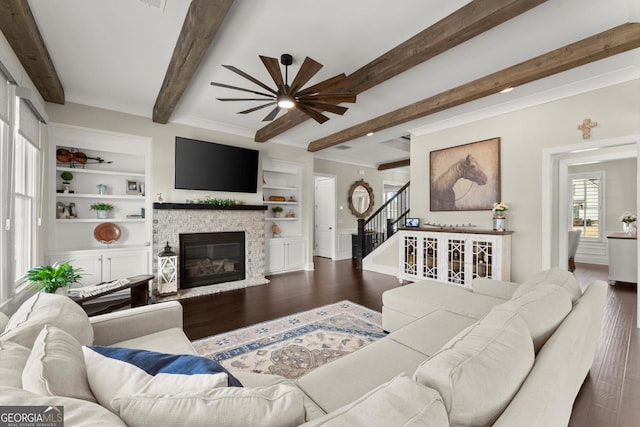 2903 Eva Clb, Acworth, GA 30101 - living room with wood finished floors, stairs, beamed ceiling, ceiling fan, and a glass covered fireplace