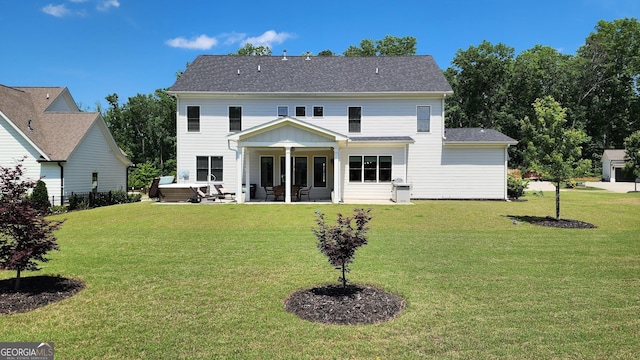 2903 Eva Clb, Acworth, GA 30101 - rear view of house featuring a patio, a lawn, and roof with shingles