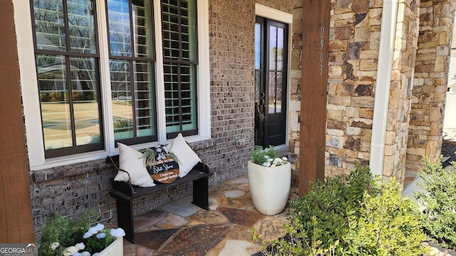 2903 Eva Clb, Acworth, GA 30101 - doorway to property with brick siding and covered porch