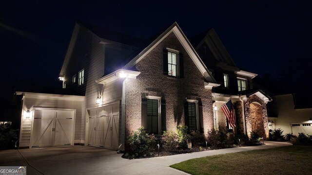 2903 Eva Clb, Acworth, GA 30101 - traditional home featuring concrete driveway, an attached garage, and brick siding