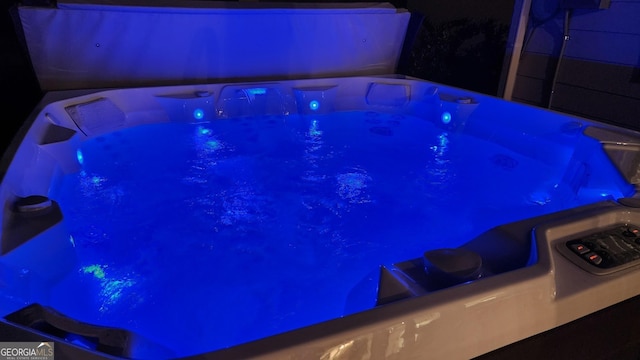 2903 Eva Clb, Acworth, GA 30101 - pool at night featuring a covered hot tub