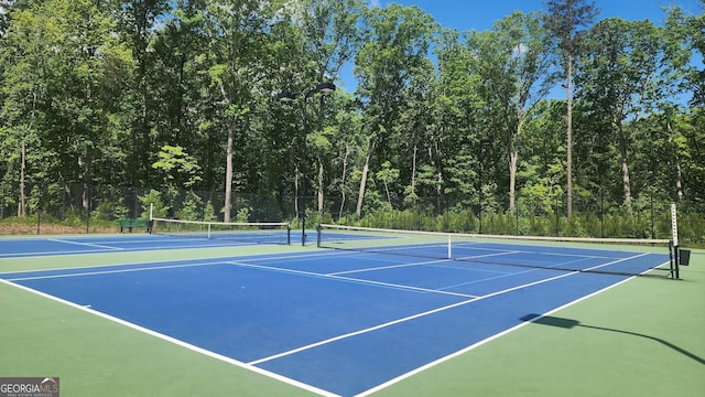2903 Eva Clb, Acworth, GA 30101 - view of tennis court with community basketball court and a wooded view