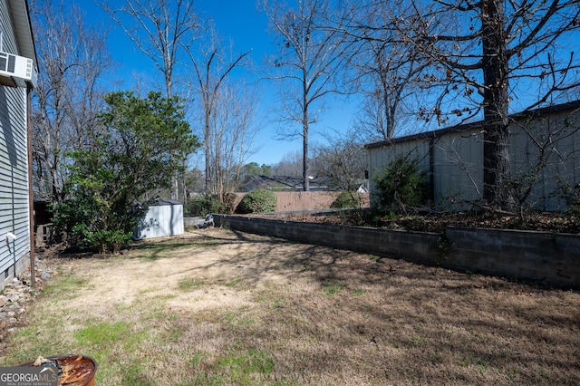 view of yard with an outdoor structure and a shed