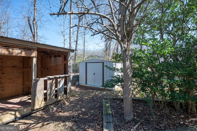 view of yard with a storage unit and an outbuilding