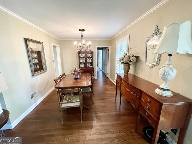 dining area with baseboards, ornamental molding, dark wood-style flooring, and a notable chandelier