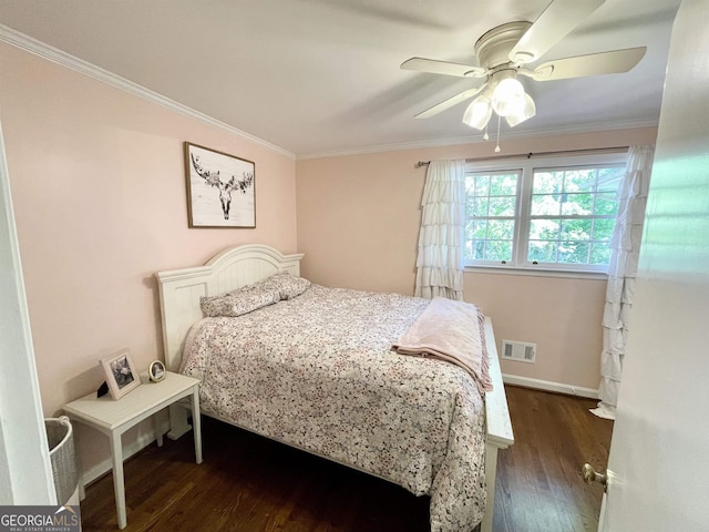 bedroom featuring baseboards, visible vents, ceiling fan, ornamental molding, and dark wood-type flooring