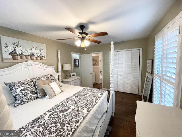 bedroom with baseboards, a ceiling fan, dark wood-type flooring, ensuite bathroom, and a closet