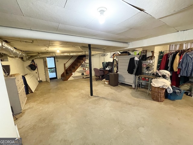 finished basement featuring stairs