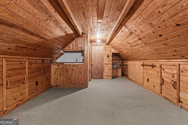 additional living space with vaulted ceiling, wooden ceiling, carpet flooring, and wood walls