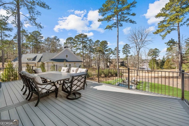 deck featuring outdoor dining area