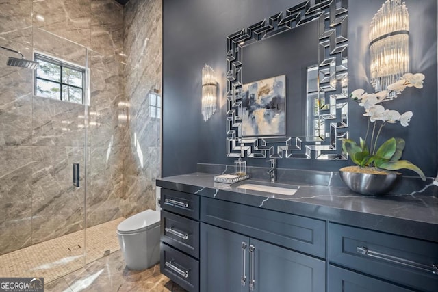 full bathroom featuring vanity, a shower stall, and toilet