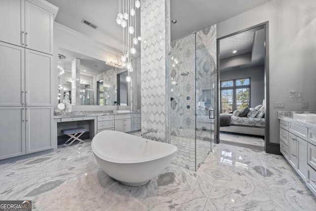 full bathroom with marble finish floor, visible vents, connected bathroom, vanity, and a freestanding tub