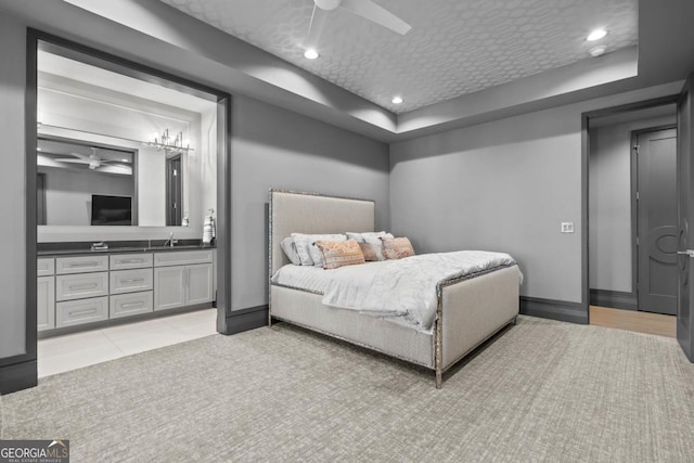 bedroom featuring baseboards, a ceiling fan, light colored carpet, a sink, and recessed lighting