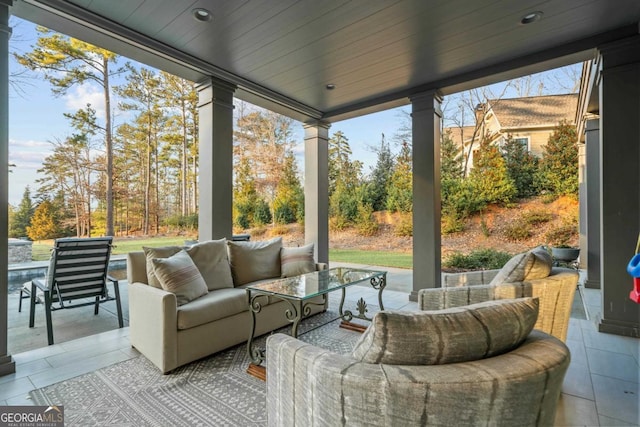 sunroom / solarium with a wealth of natural light and wood ceiling