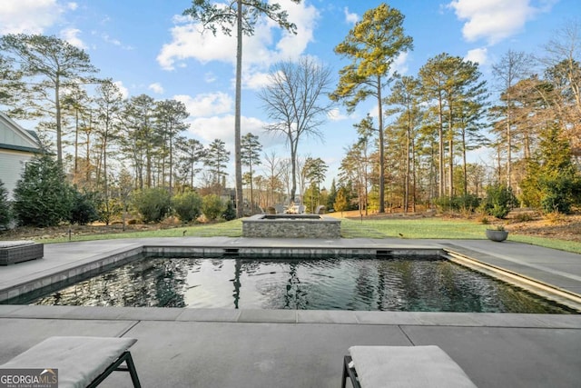 outdoor pool with a jacuzzi