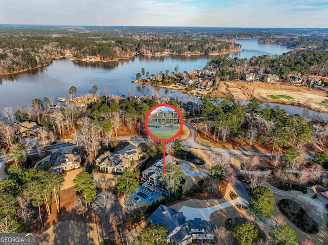 birds eye view of property featuring a water view