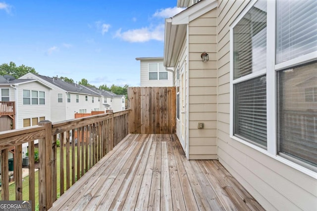 wooden deck featuring a residential view