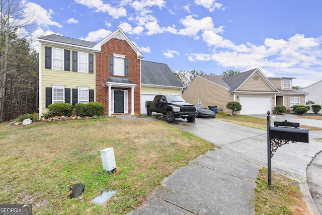 view of front of house featuring a garage, driveway, and a front lawn