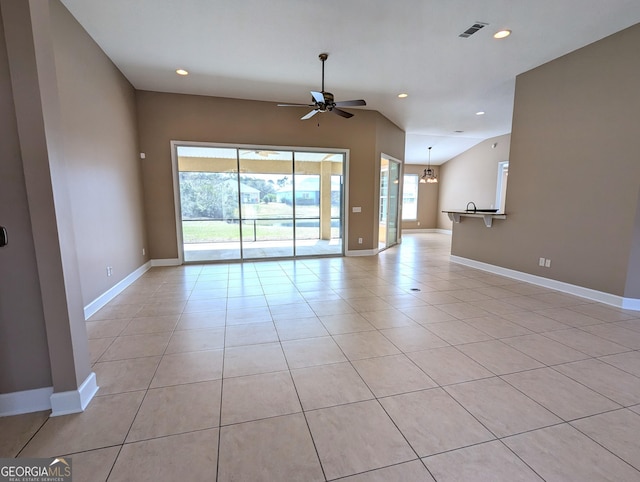 spare room with ceiling fan with notable chandelier, baseboards, visible vents, and recessed lighting