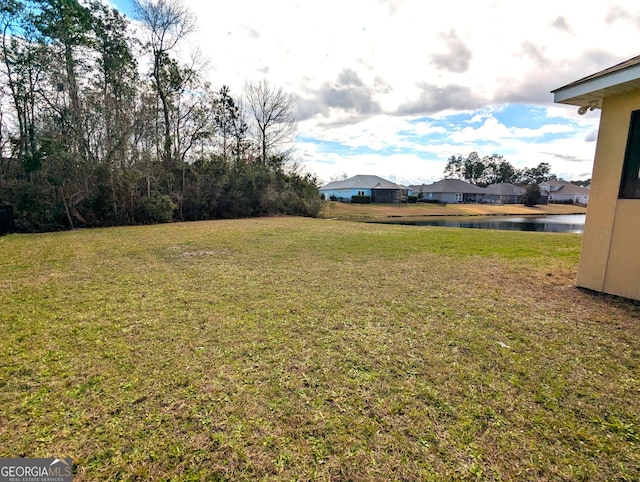 view of yard with a water view