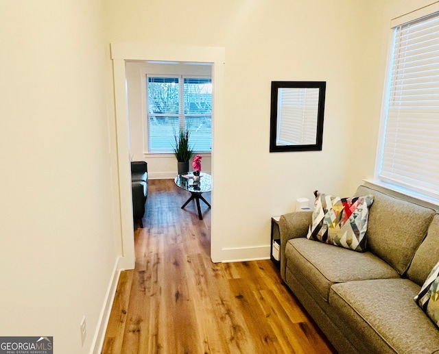 living room featuring light wood-style flooring and baseboards