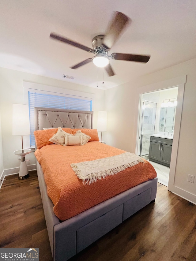 bedroom featuring visible vents, dark wood finished floors, and baseboards