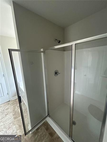 full bathroom featuring a stall shower