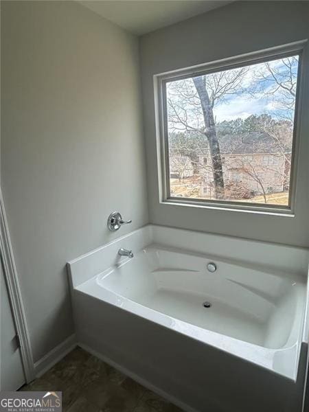 full bathroom featuring a bath