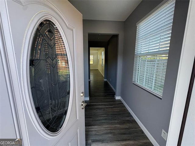 interior space with dark wood-style floors and baseboards