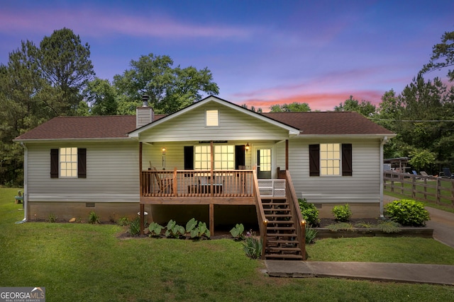 ranch-style home with crawl space, a chimney, a front lawn, and stairs