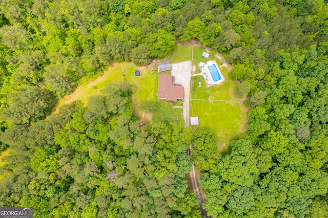 bird's eye view featuring a forest view