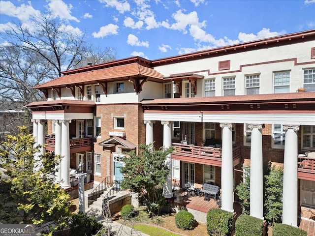 view of front of home featuring brick siding