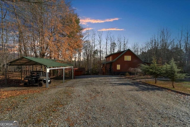 view of road with gravel driveway