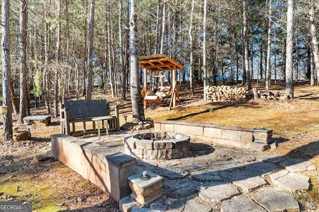 view of yard with an outdoor fire pit