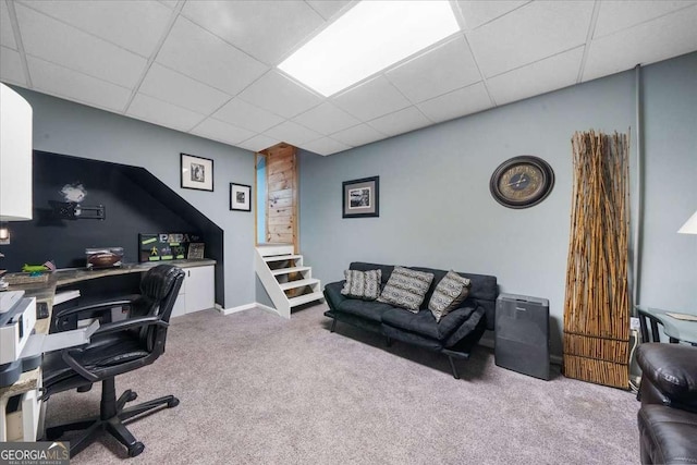 office space featuring carpet floors and a paneled ceiling