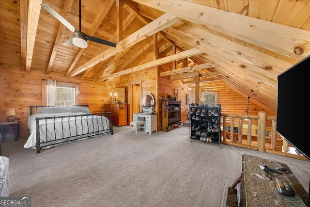 bedroom featuring lofted ceiling with beams, carpet, wood ceiling, and wooden walls