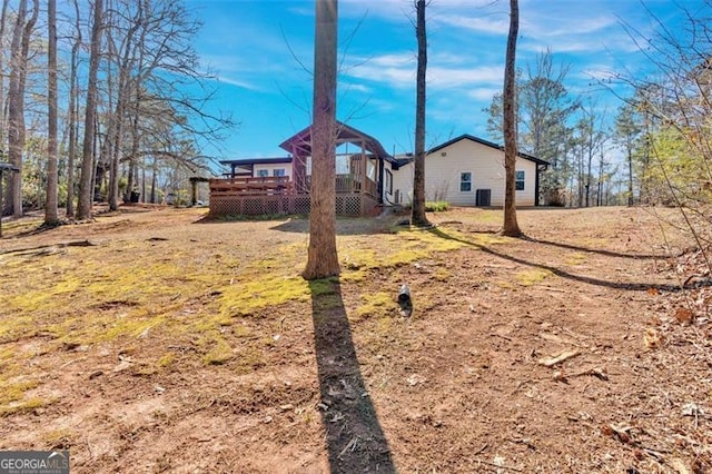 view of yard with a wooden deck