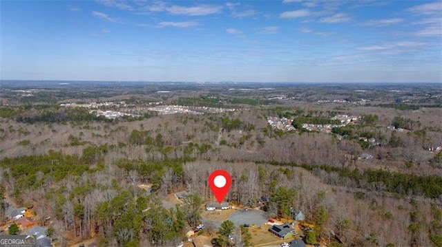 drone / aerial view featuring a view of trees