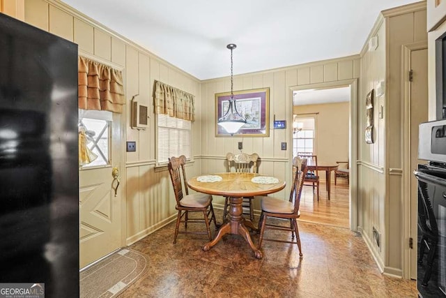 dining area featuring crown molding