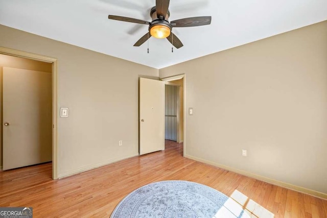 bedroom with baseboards, ceiling fan, and light wood finished floors