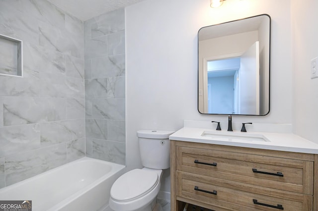 bathroom with tub / shower combination, vanity, and toilet