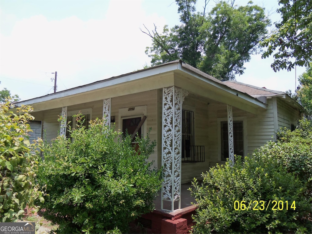 view of home's exterior with covered porch