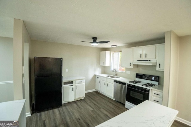 kitchen with white range with gas stovetop, freestanding refrigerator, light countertops, under cabinet range hood, and stainless steel dishwasher