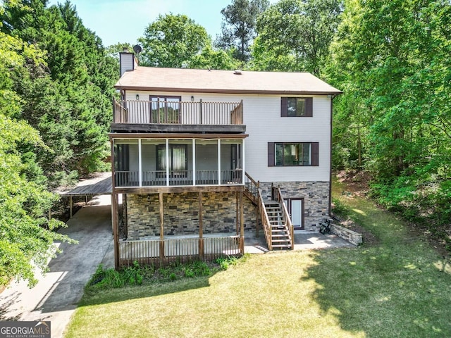 71 Canvasback Ct, Monticello, GA 31064 - rear view of property with stairway, a chimney, a balcony, a yard, and stone siding