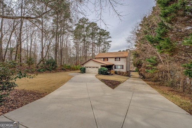 view of front of house with a garage and stucco siding