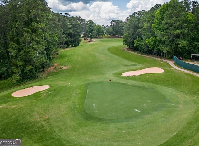 surrounding community with view of golf course