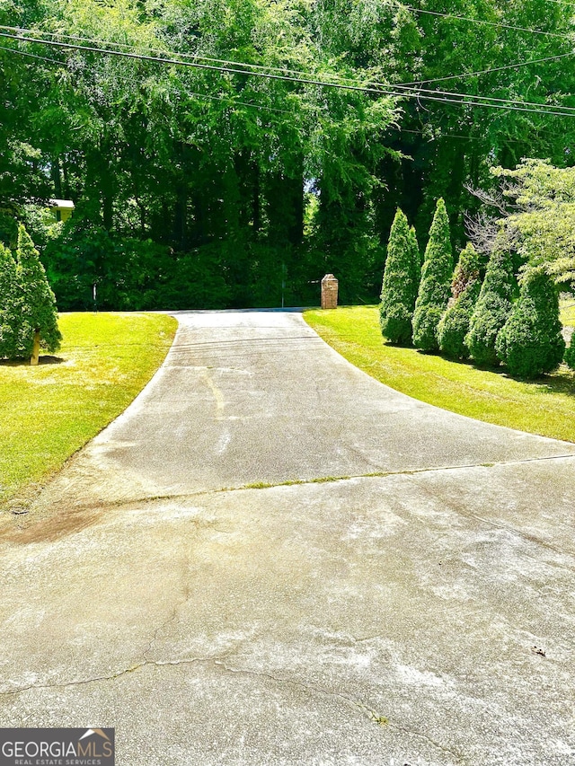 exterior space featuring concrete driveway