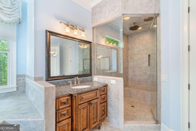 bathroom with a stall shower and vanity