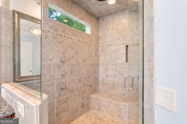 bathroom featuring a shower stall